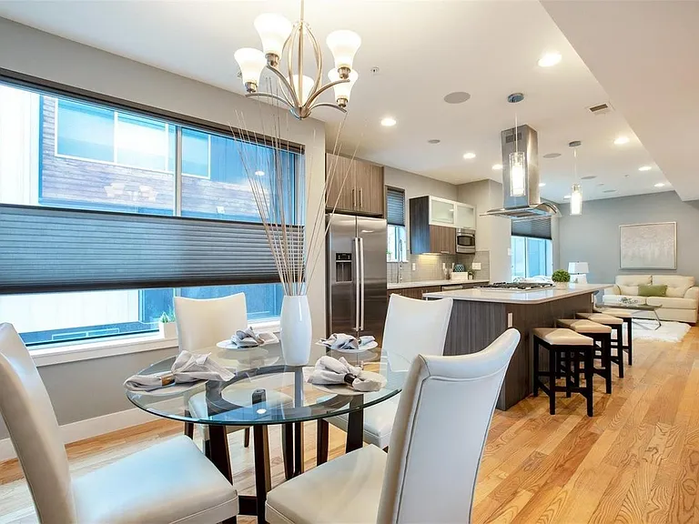 Main Living Level with kitchen, living room, dining room and small deck