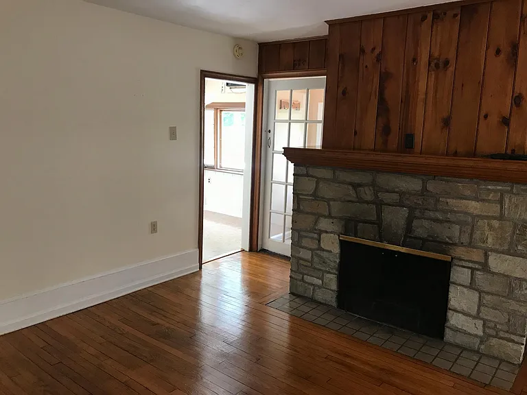 Entry off stairs from from door. And door to kitchen off the living room area.