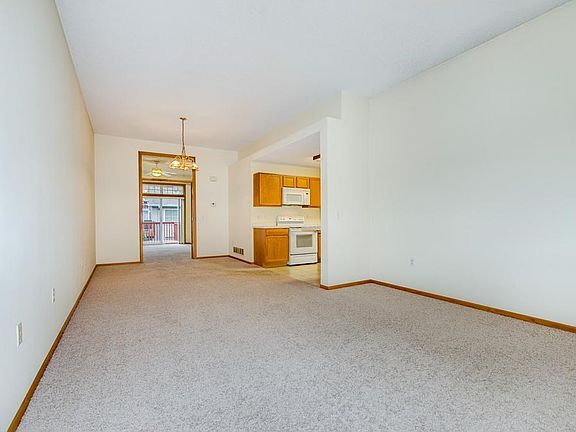 View from the living room to the dining room, french doors lead to a 4-season porch!