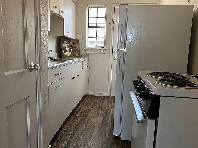 Kitchen with Window and White Accessories