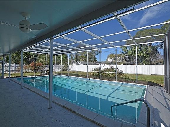 Covered & screened lanai with newly resurfaced 18x36 pool.