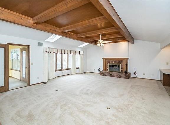 Bay window, Beamed Wood Ceiling, Fireplace, Sunroom, Cat5 wiring, surround sound, Dry Bar, Etc.