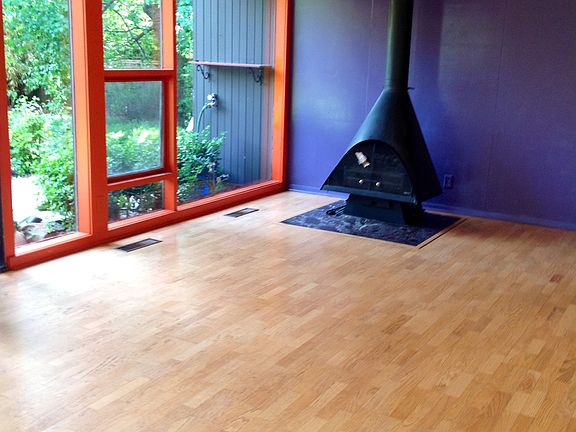 WALL OF WINDOWS. FIREPLACE.