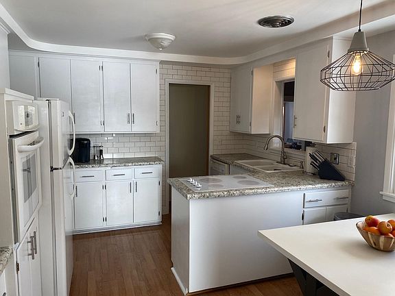 updated kitchen with subway tile and new counters; tons of storage