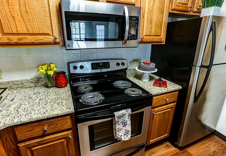 Homey Kitchen Featuring Stainlness Steel Appliances