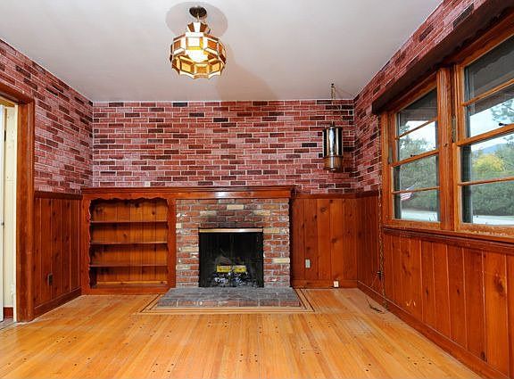 Den with second fireplace