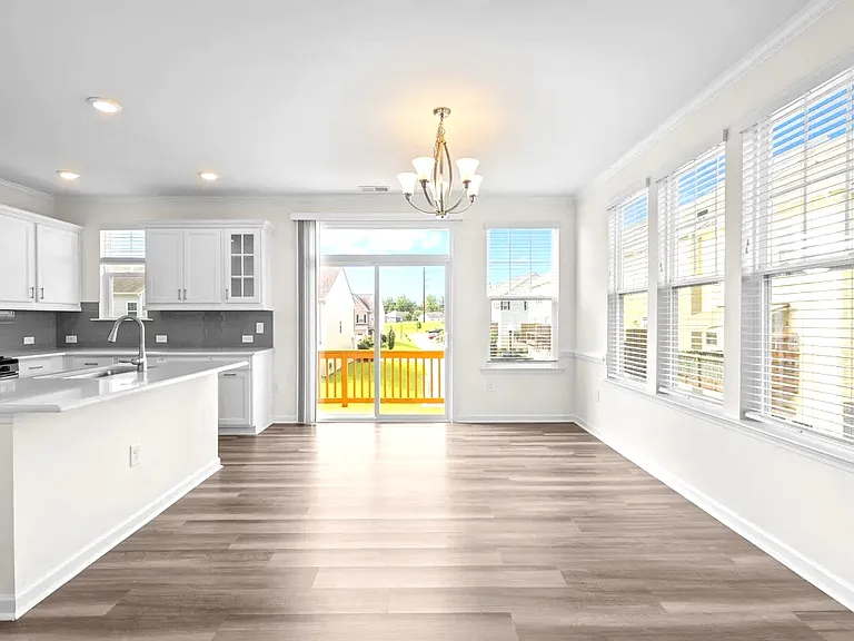Tons of natural light. End unit looks out onto large grassy area, and sunset view.