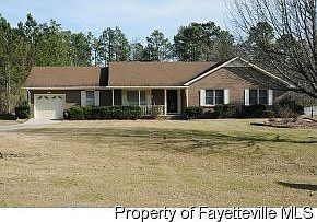 Front of house. Dog wood has been planted since picture was