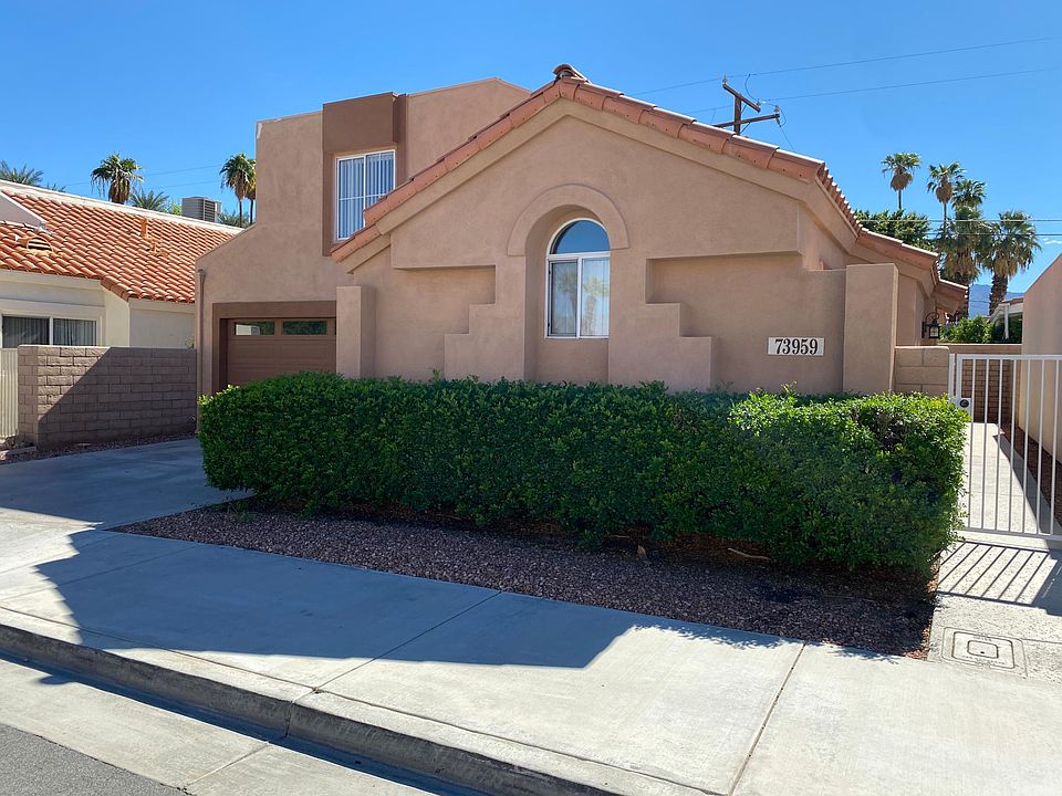 Front of Home. Entry is thru the security gate on the right side.