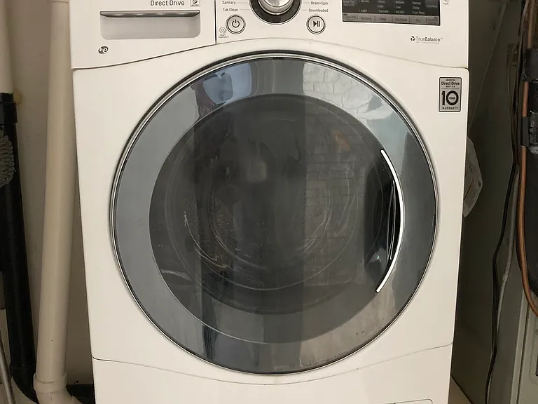 Laundry unit (washer and dryer combined) in utility closet