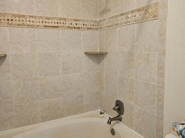 Master bath with garden tub and tile surround