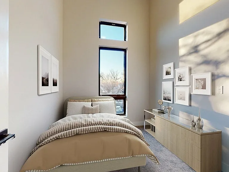 Bright Bedroom with Large Windows and High Ceilings