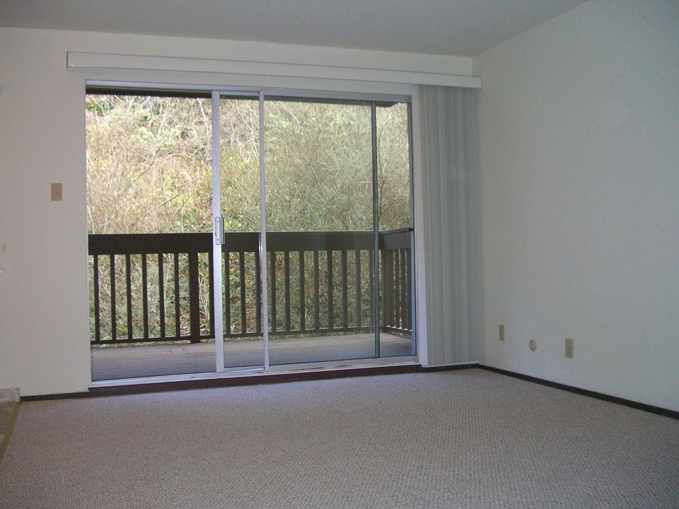 Living Room with sliding glass door to private deck with hil