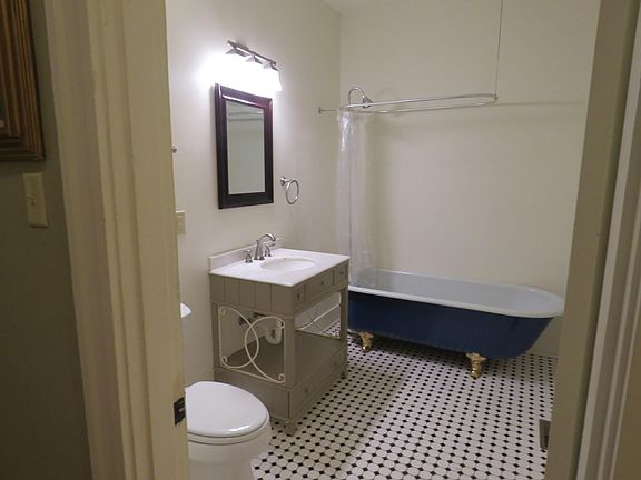 Clawfoot tub in large bathroom.