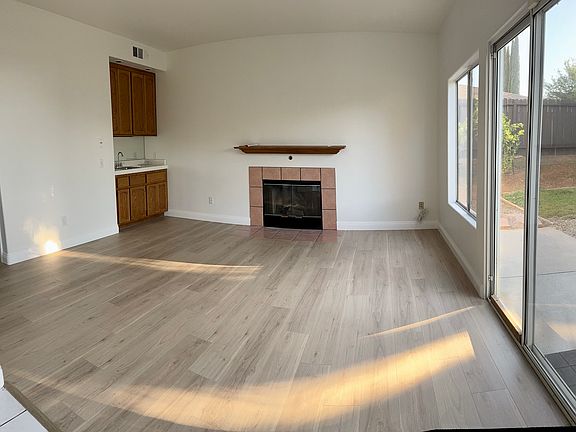 Family room w/ wetbar and cozy fireplace