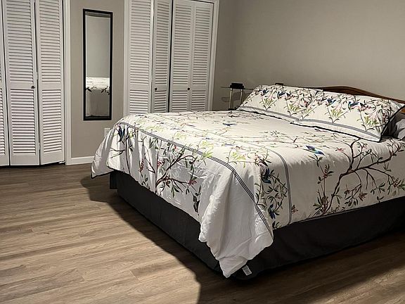 Master bedroom with attached bathroom, two closets and a wall of storage as well.