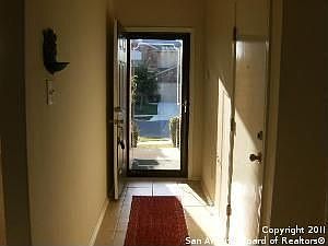 Tiled Entry with Glass Storm Door