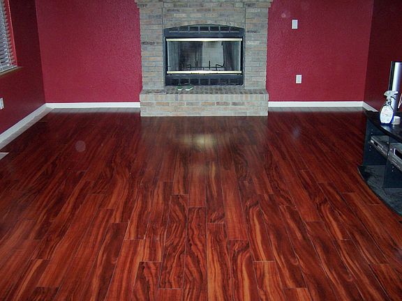 New wood flooring in Living Room. With a view of the fireplace.
