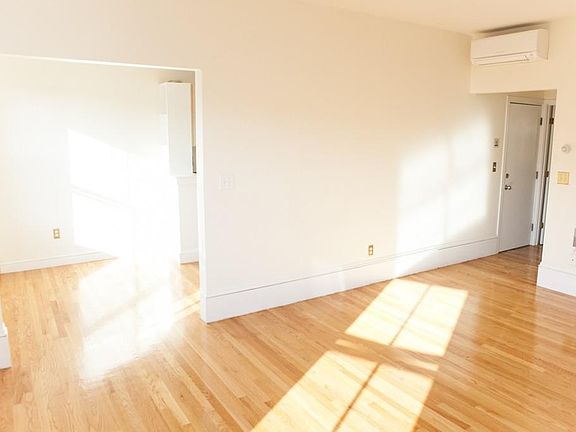 living room and dining area/ kitchen entrance