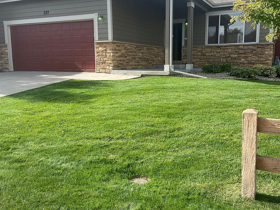 Beautiful front yard; 2-car garage.