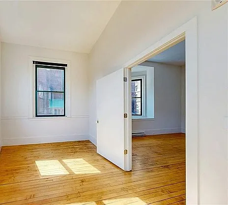 Bedroom, facing from closet to bedroom entry door.