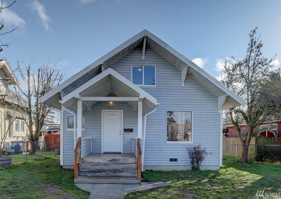 3511 South J Street Tacoma WA.  2 bedrooms downstairs with full bathroom. Living room and dining room with new laminate flooring, kitchen and utility room/mud room at the back of the home with outside entrance to large back yard. 