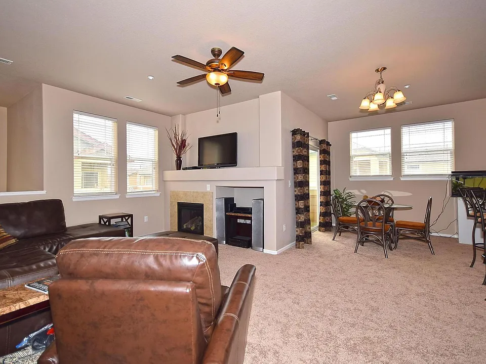 Cozy Living room with ceiling fan and natural gas fireplace