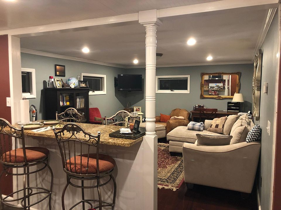 Living room and granite countertop dining.