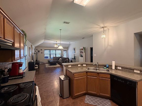 Open space kitchen -comes with a fridge