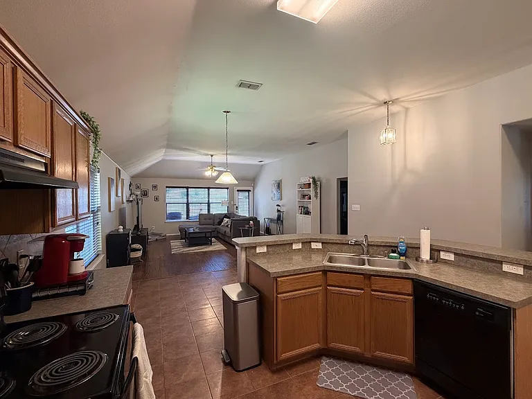 Open space kitchen -comes with a fridge