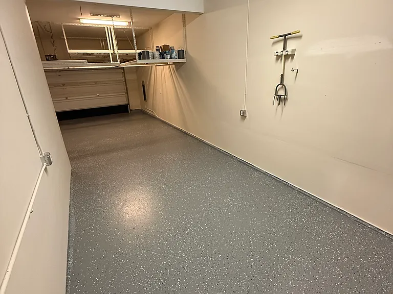 3 Car Garage with Epoxy finish and plenty of overhead storage