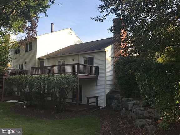 View of rear of home with two large decks