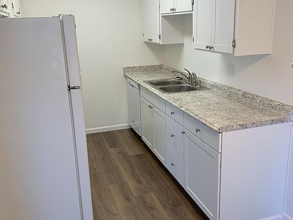 Kitchen with beautiful cabinets with plenty of storage. and brand new GE dishwasher