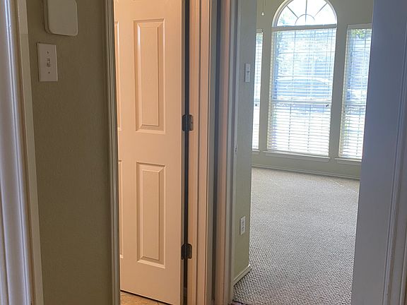 Downstairs bath on left, bedroom ahead.