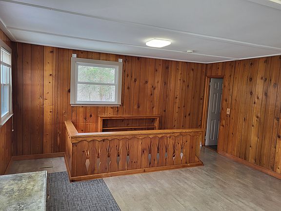 this is otherside of upper floor room showing staircase to finished basement lower floor