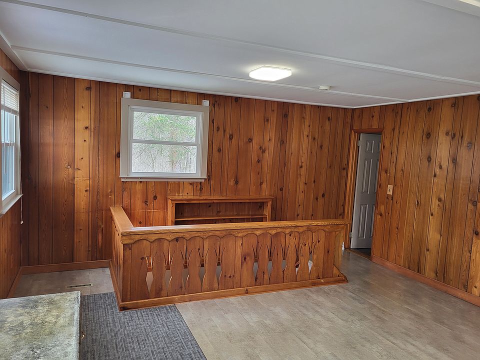 this is otherside of upper floor room showing staircase to finished basement lower floor