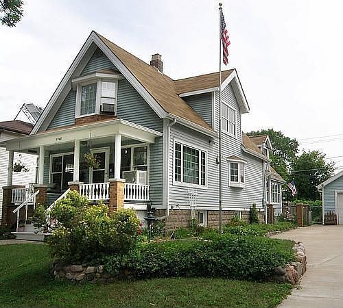 View of house with perennial flowers