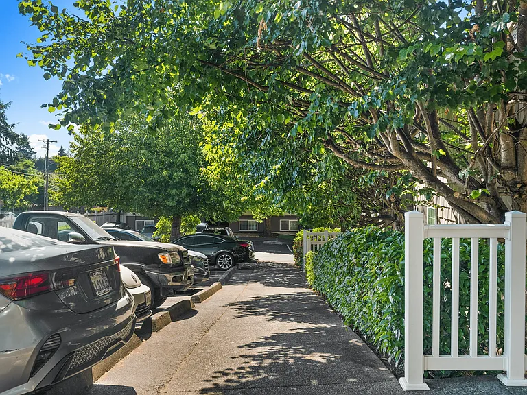 Sidewalk access alongside convenient resident parking.