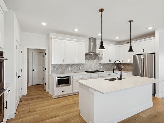 The kitchen has beautiful stunning tile backsplash.