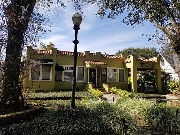 Front of house with oaks