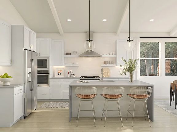 Kitchen with pendant lighting and vaulted ceiling
