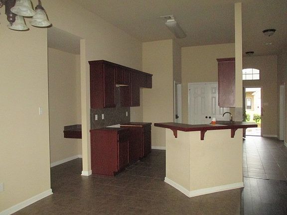 kitchen view from dining area, left opening is build in desk on way to main suite