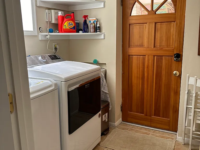 Private entrance and laundry room.