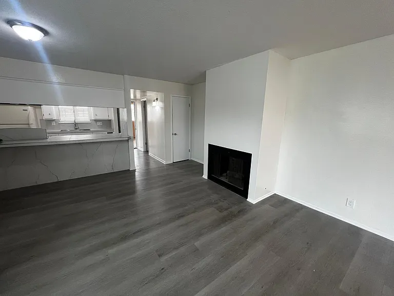 Open floor plan dining, living room, kitchen and fireplace