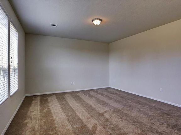 Downstairs includes flex room that can be used as a study, formal living, or formal dining.