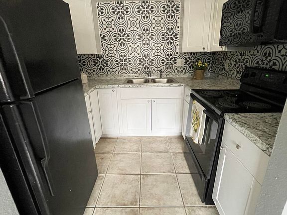 All appliances included. Tile backsplash.