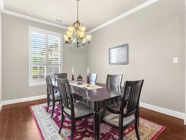 One of two dining options, this formal dining room can accommodate any table shape. Not SHOWN off the formal dining room to the right
a first floor home office with privacy French doors.