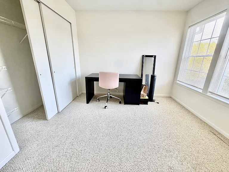 Bright office / guest bedroom includes large closet for storage