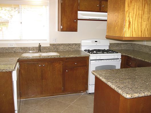 Kitchen with new granite and new gas range