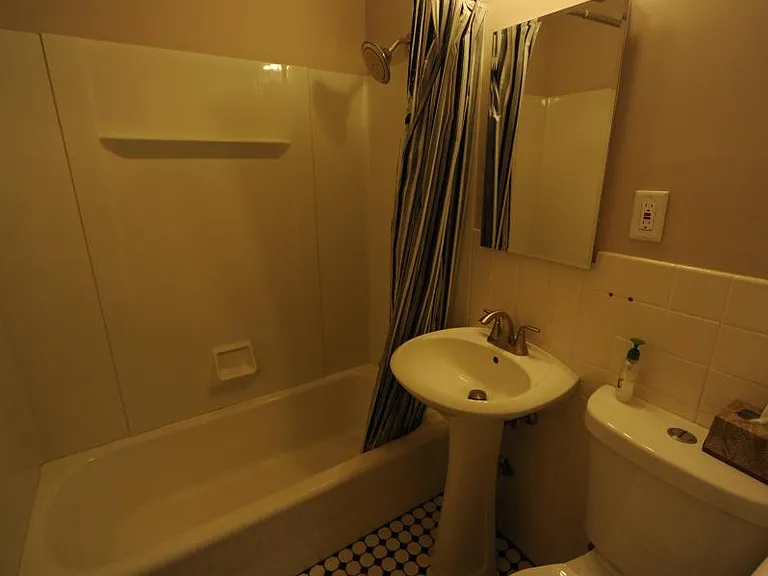 retiled bathroom with linen closet